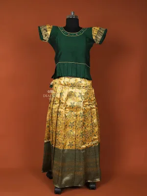 Dark Green Silk Pattu Pavadai Set Adorned with Stones and Zariwork